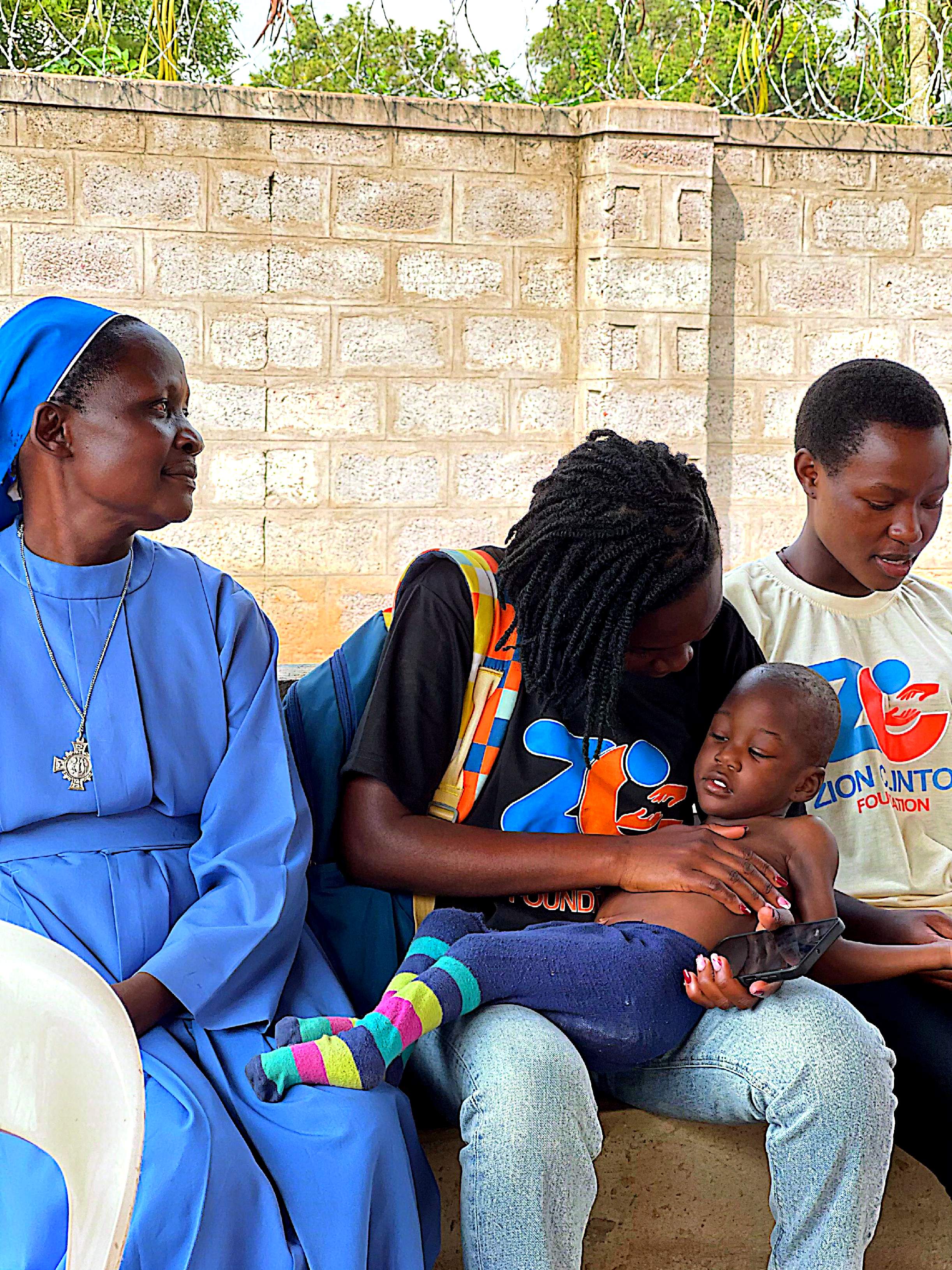 Volunteers and community members at a Zion Clinton Foundation outreach